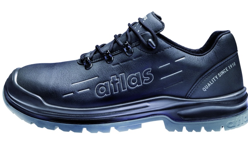 Mehrere schwarze Sicherheitsschuhe in unterschiedlichen Ausführungen, darunter Modelle mit niedrigem und hohem Schaft, mit klassischer Schnürung oder mit einem runden Drehverschluss-System